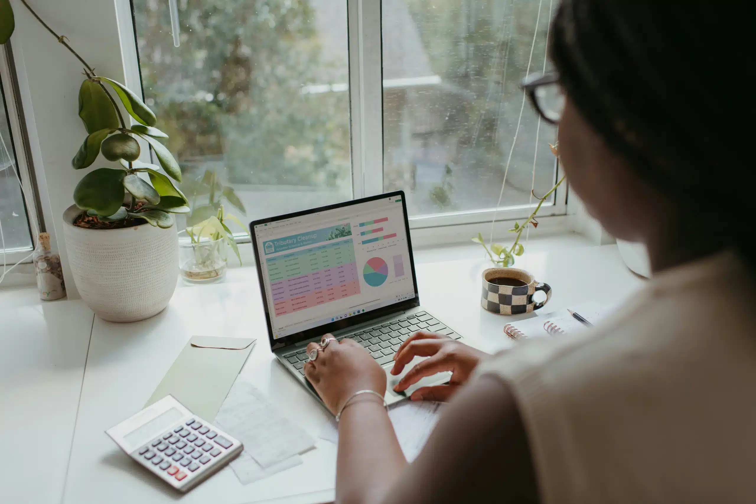 A woman tracking her earnings from paid studies.